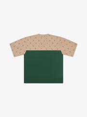 Two-tone shirt with beige patterned top and green bottom on a white background