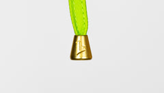 Gold bell with a green rope on a white background