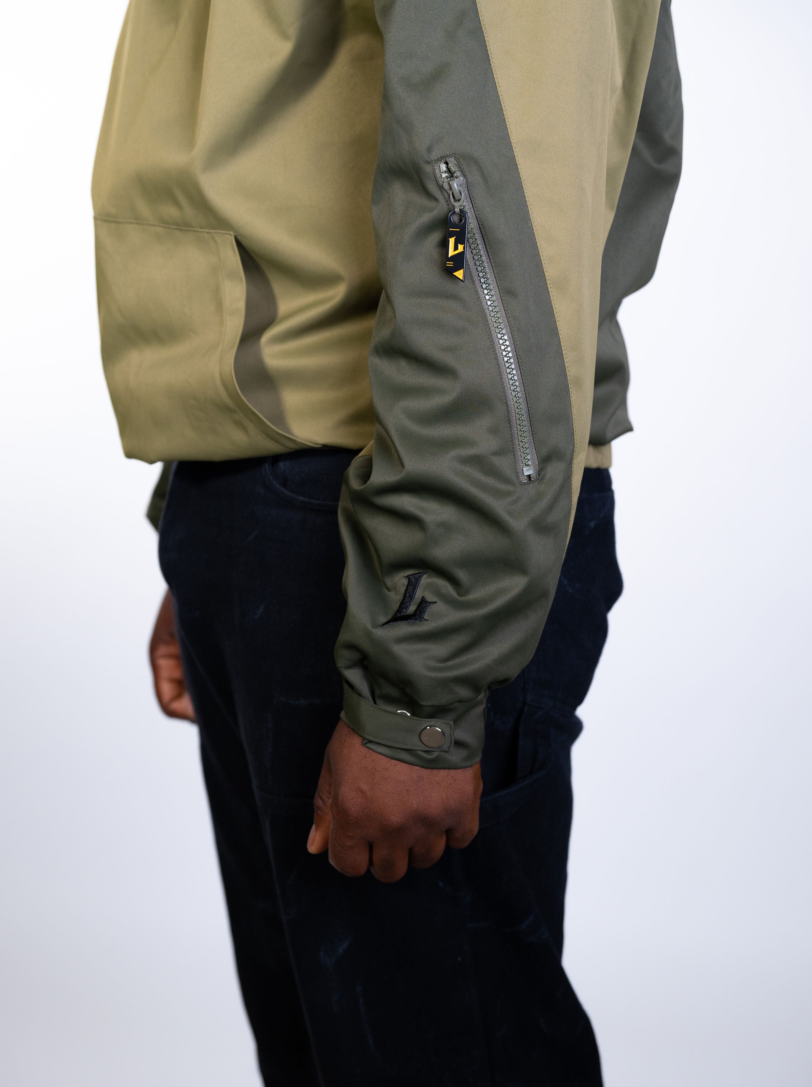 Person wearing a green jacket with a white background