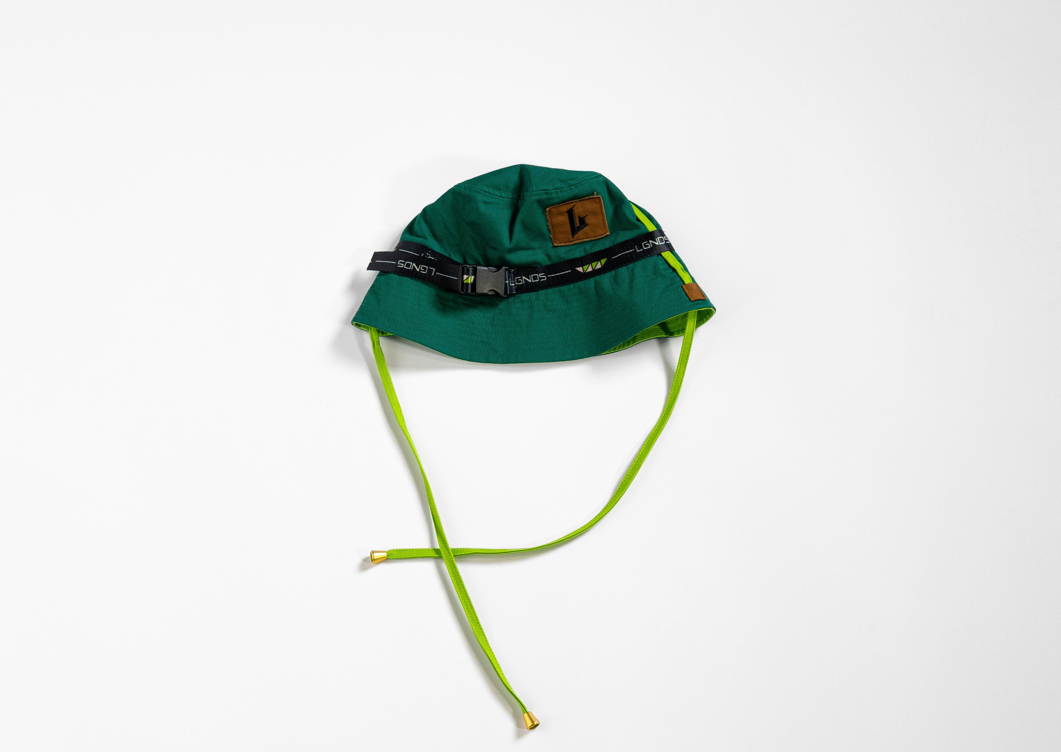 Green bucket hat with a brown logo on a white background
